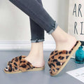 Pink cross strap slippers leopard plush house shoes featuring leopard-print fuzzy upper and light brown rubber sole