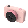 Pink digital mini camera for children with a black circular lens assembly engraved with camera lens made in china