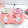 Pink dual chamber chocolate melting pot with silver-rimmed bowls and white control dials for chocolate melting furnace