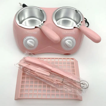 Pink dual chamber chocolate melting pot with stainless steel bowls and white control knobs for chocolate melting furnace use