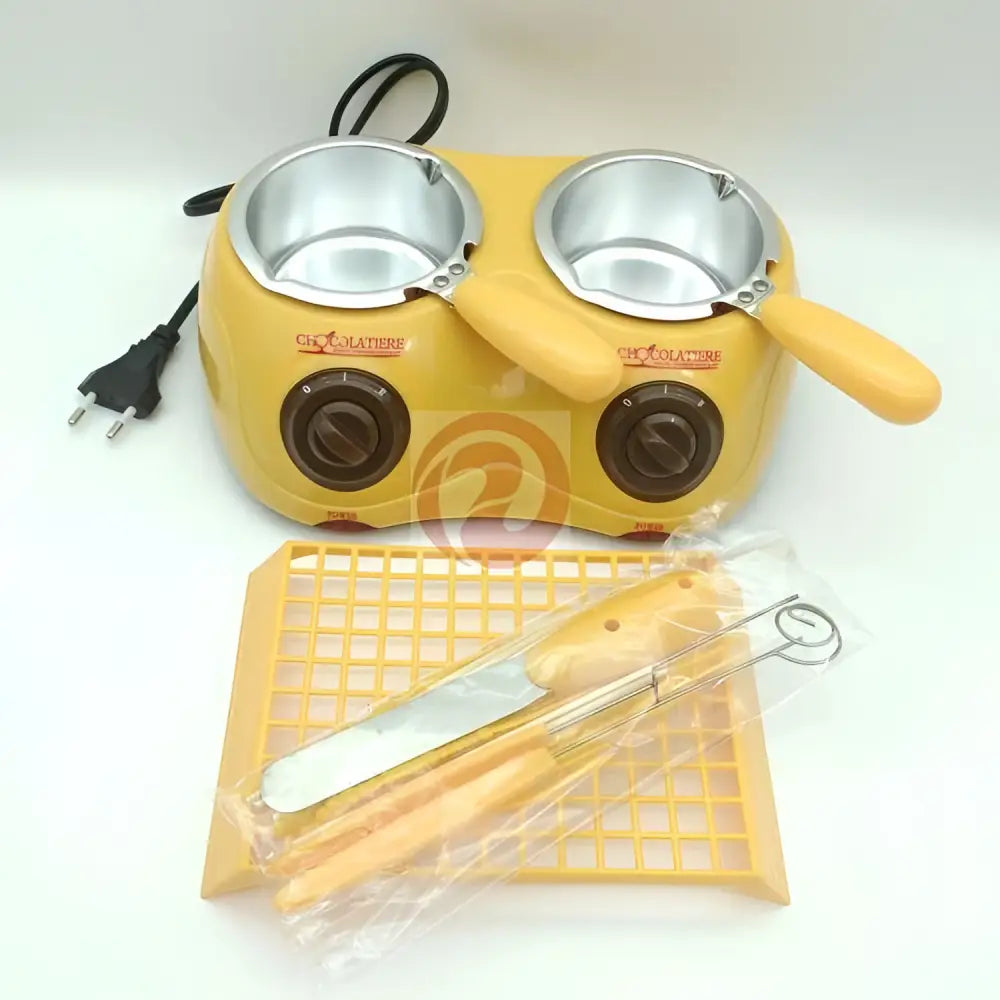 Yellow dual chamber chocolate melting pot with silver interiors brown knobs and matching yellow tray and utensils for melting furnace