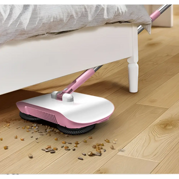 Pink and white electric hand push sweeper household broom with a sleek modern design for efficient floor cleaning