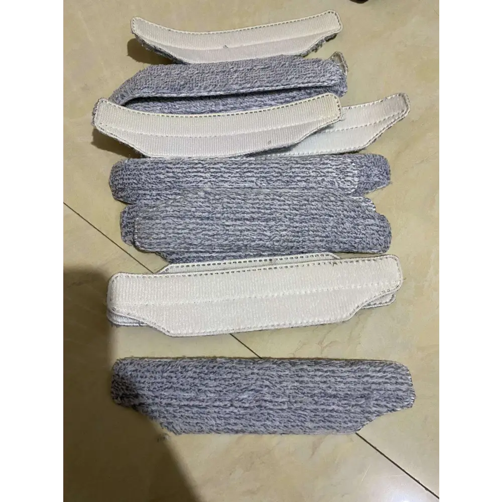 Gray textured fabric armrest covers with white elastic straps for pink electric hand push sweeper household broom