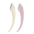 Two slender curved beauty razors with cream and pink plastic handles for precise pink eyebrow trimming and trimming use