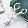White-handled hair-cutting scissors with metallic blade and comb attachment in pink eyebrow trimming knife and scissors set for precise eyebrow trimmer use