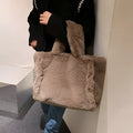 A cozy beige faux fur tote bag with braided handles and sides featuring soft plush texture and chain plush handbag style