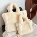 Cream-colored faux fur handbag with soft plush texture and matching handles in pink faux fur chain plush handbag style