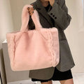Soft pink faux fur chain plush handbag tote bag with soft plush texture and matching handles for stylish use