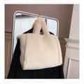 Cream-colored tote bag with soft plush texture and matching handles featured in pink faux fur chain plush handbag