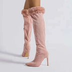 Pink suede knee-high boots with pink faux fur trim and a fine pointed stiletto heel high heel design