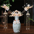 Elegant gold-toned hairpin crown adorned with pink floral hanfu motifs and pearl gold chain tassels