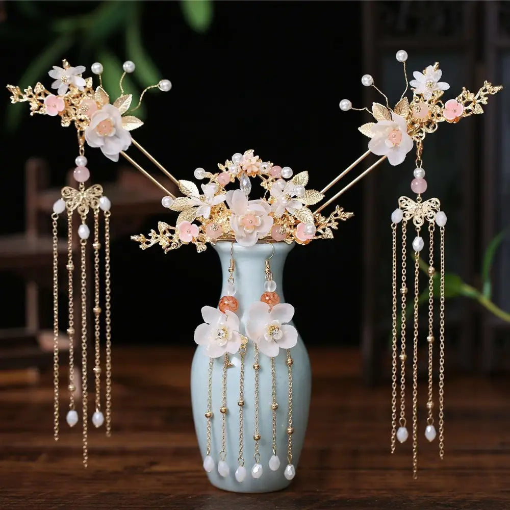 Elegant gold-toned hairpin crown adorned with pink floral hanfu motifs and pearl gold chain tassels
