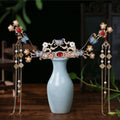 Pink floral hanfu hairpin crown adorned with gold, blue butterflies, pink blossoms, red gemstones, and pearl strands