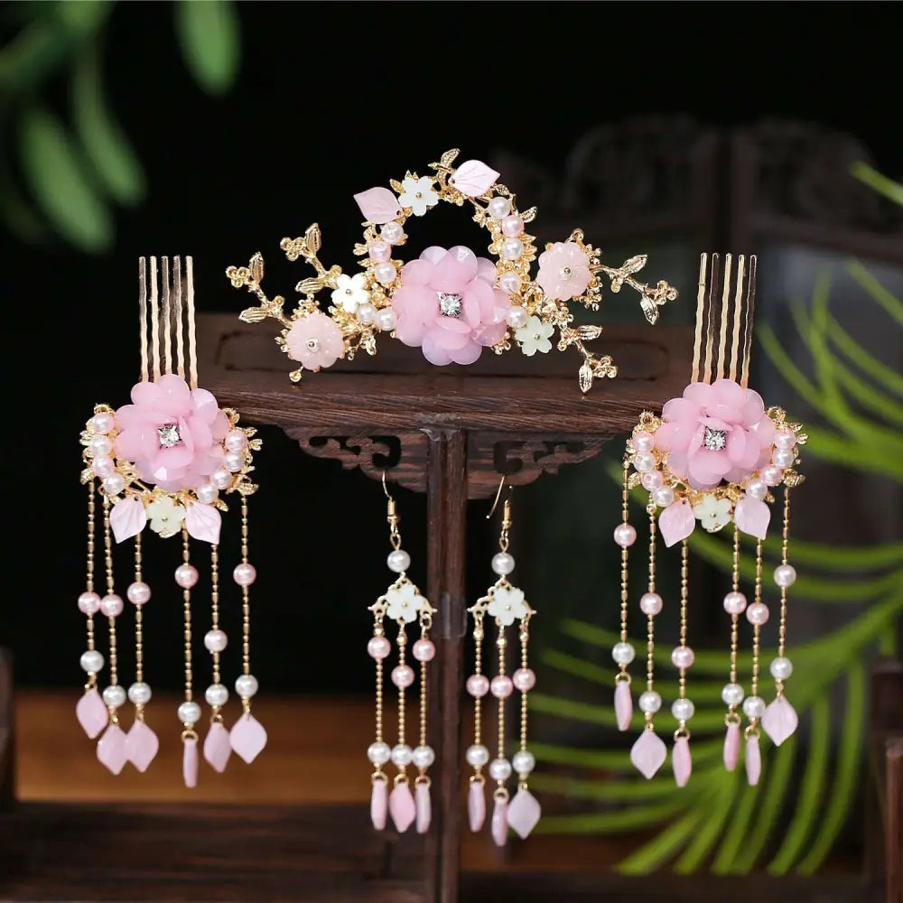 Elegant pink floral hanfu hairpin crown adorned with gold accents pearls and dangling crystal beads for formal wear