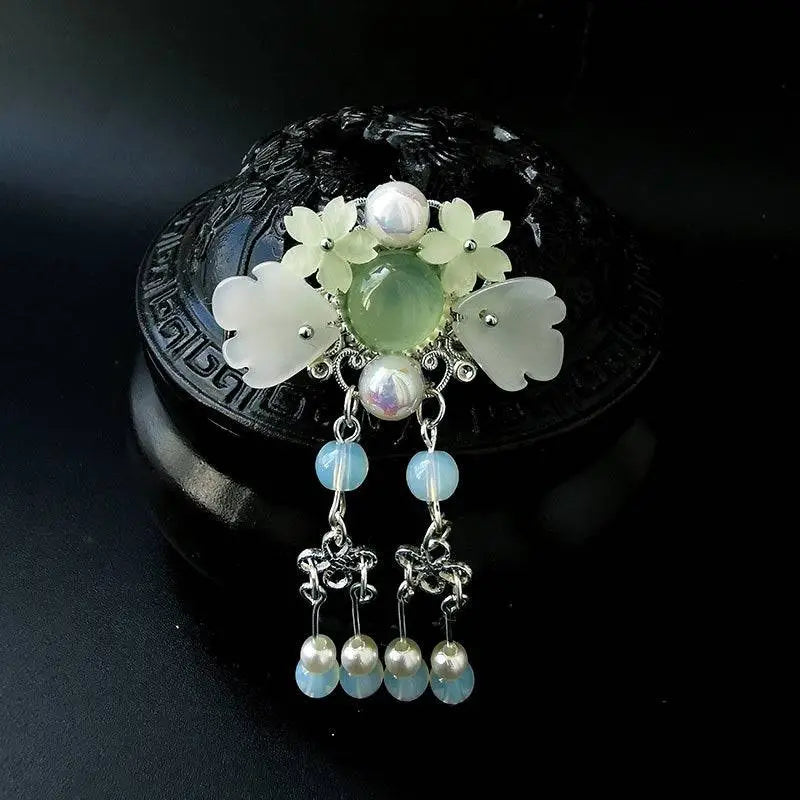 Elegant jade and pearl retro headgear girls hairpin with silver filigree, white floral motifs, and blue opal beads