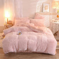 Pink fluffy faux fur plush duvet cover set with soft texture and matching pillows for cozy bedroom decor