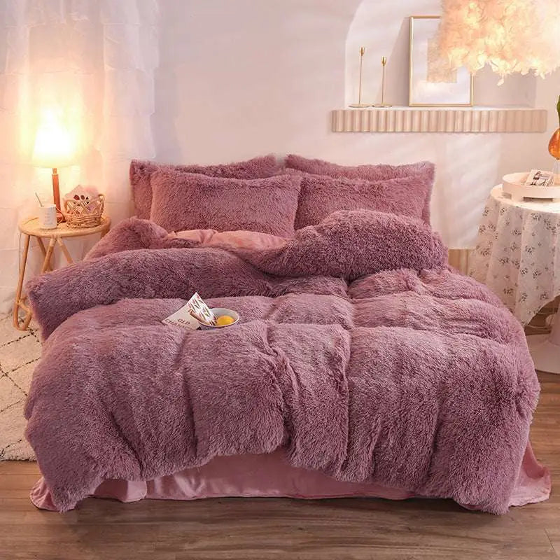 Pink fluffy faux fur plush duvet cover set with mauve color and matching pillowcases in soft faux-fur texture