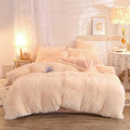 Pink fluffy faux fur plush duvet cover set with matching pillows featuring soft blush-colored fluffy faux fur for cozy comfort