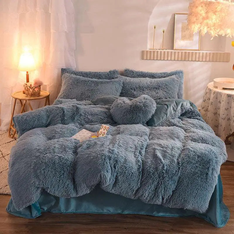 Cozy blue fluffy faux fur comforter set with plush duvet cover, matching pillows, and satin-edged bed skirt
