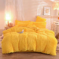 Bright yellow plush duvet cover set with matching pillows featuring fluffy faux fur material for cozy comfort