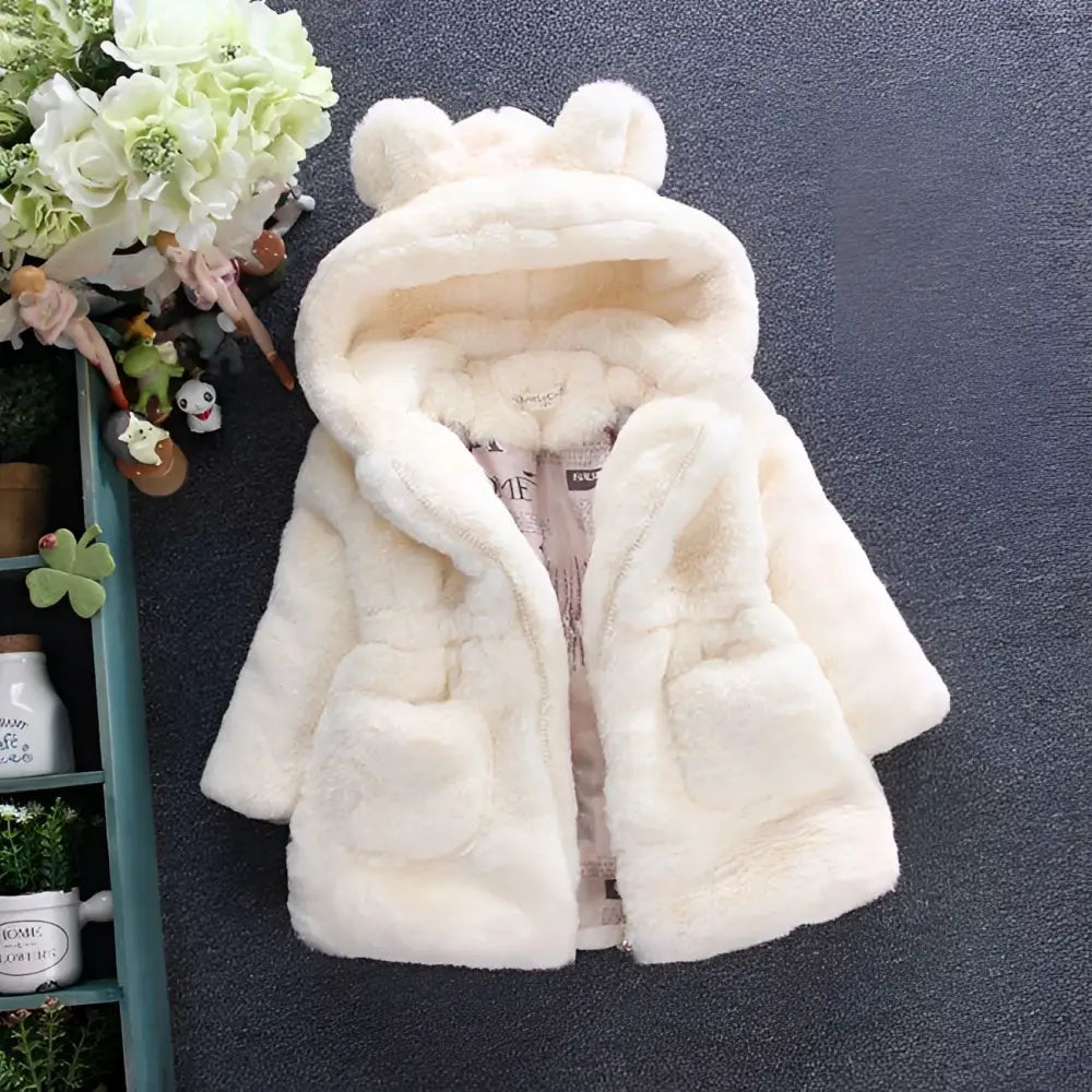Cream-colored plush children’s coat with bear ear hood and front pockets from pink girls fuzzy ear hooded fur collection