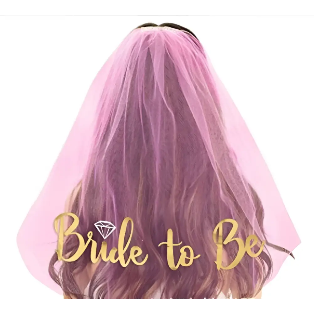A delicate pink tulle bridal veil with gold foil bride lettering and diamond-shaped embellishment popular tulle design
