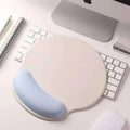 Beige and light blue memory foam soft mouse pad with contoured wrist rest for wrist health in pink gradient memory style