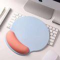 Light blue ergonomic mouse pad with peach wrist rest made of memory foam soft material for wrist health
