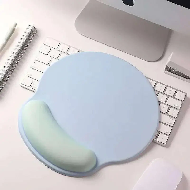 Light blue memory foam soft mouse pad with curved mint green wrist rest for wrist health and pink gradient memory comfort