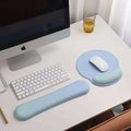Light blue ergonomic gel wrist rest with cushioned surface and rounded edges for wrist health support with memory foam soft features