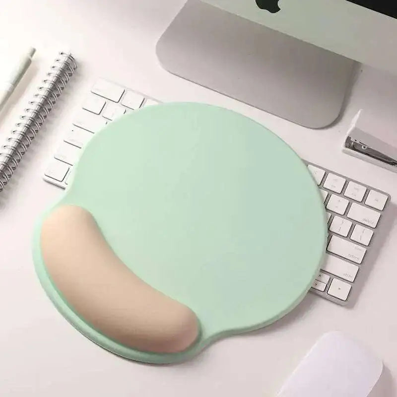 Mint green ergonomic gel mouse pad with beige wrist rest designed for wrist health and memory foam soft comfort