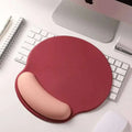 Red ergonomic mouse pad with pink gradient memory foam soft wrist rest designed for wrist health support