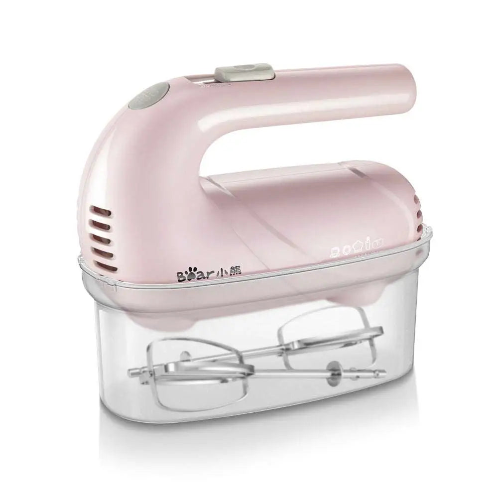 Pink handheld electric whisk with clear plastic base housing beaters ideal for luxury women’s fashion and plus size dresses