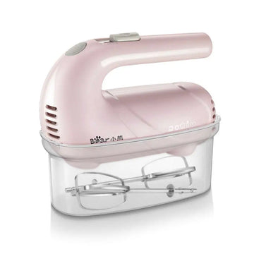 Pink handheld electric whisk with clear plastic base housing beaters ideal for luxury women’s fashion and plus size dresses trends