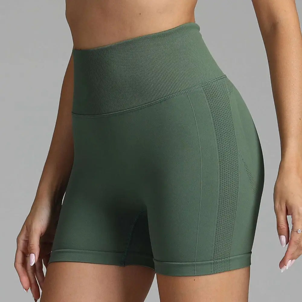Olive green high waist seamless yoga shorts with ribbed waistband and mesh side panel for women