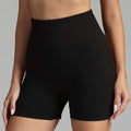 Black high waist athletic shorts with ribbed waistband and mesh side panels for seamless yoga shorts use