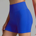 Vibrant royal blue high waist seamless yoga shorts with ribbed waistband and breathable mesh side panels