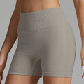 Gray high waist seamless yoga shorts with ribbed waistband and mesh panel detailing for women