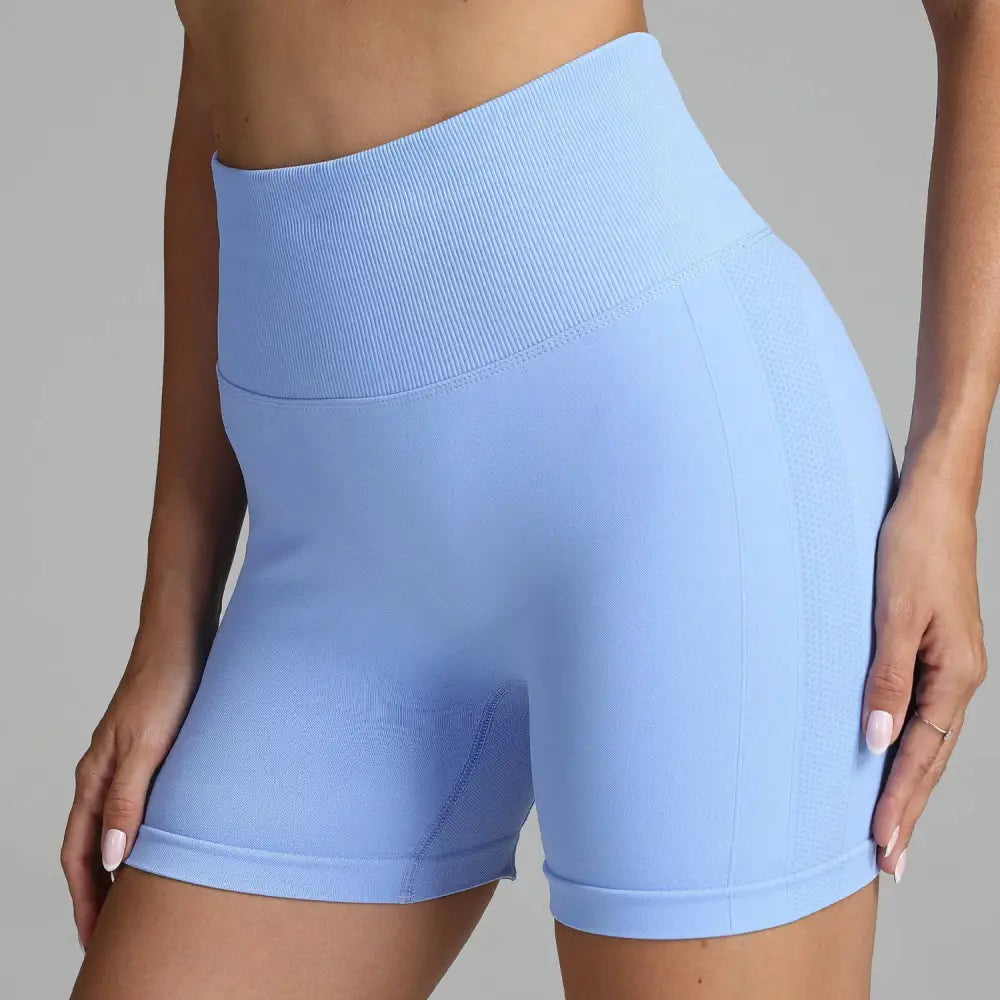 Light blue high waist seamless yoga shorts with ribbed waistband and textured side panels for women
