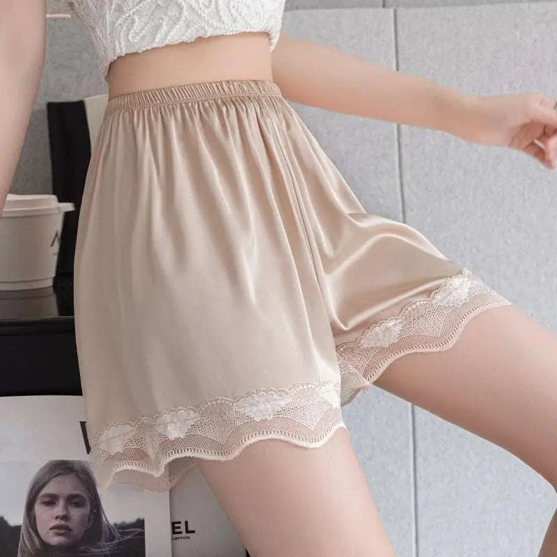 Beige satin ice silk seamless shorts with delicate white lace trim along the hem in lace trim shorts style