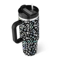 Black pink kiss insulated tumbler with steel handle straw featuring leopard print in white and iridescent teal