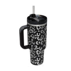 Black insulated tumbler with silver leopard print featuring a steel handle straw and black lid from Pink Kiss collection
