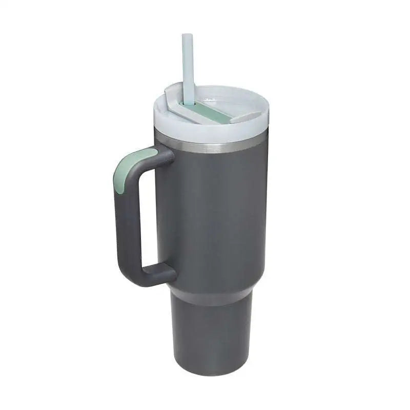 Gray insulated tumbler with light green accents and white lid featuring a pink kiss steel handle straw integrated design