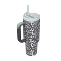 Gray and white leopard-print insulated tumbler with pink kiss steel handle straw, silver rim, and light green straw