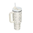 Cream-colored insulated tumbler with silver leopard print, white lid, and steel handle straw from Pink Kiss collection