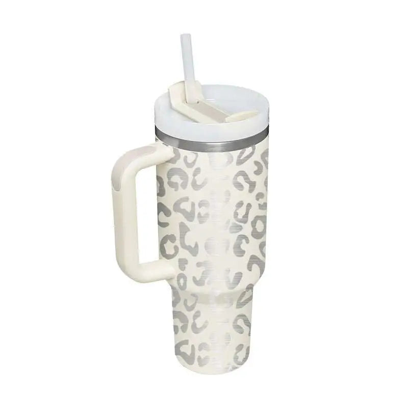 Cream-colored insulated tumbler with silver leopard print, white lid, and steel handle straw from Pink Kiss collection
