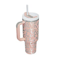 Pink kiss insulated tumbler with steel handle straw featuring pink insulation and silver leopard print pattern