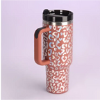 Pink kiss insulated tumbler with pink and white leopard print, stainless steel handle straw, black lid and handle
