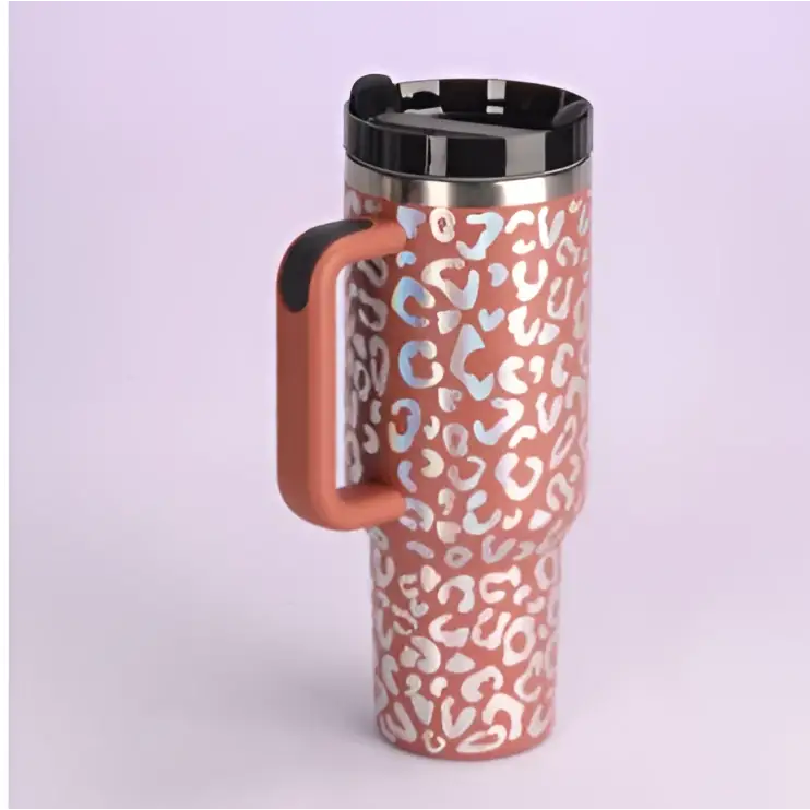 Pink kiss insulated tumbler with pink and white leopard print, stainless steel handle straw, black lid and handle
