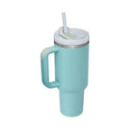 Teal pink kiss insulated tumbler with steel handle straw, white lid, and metallic rim for durable use